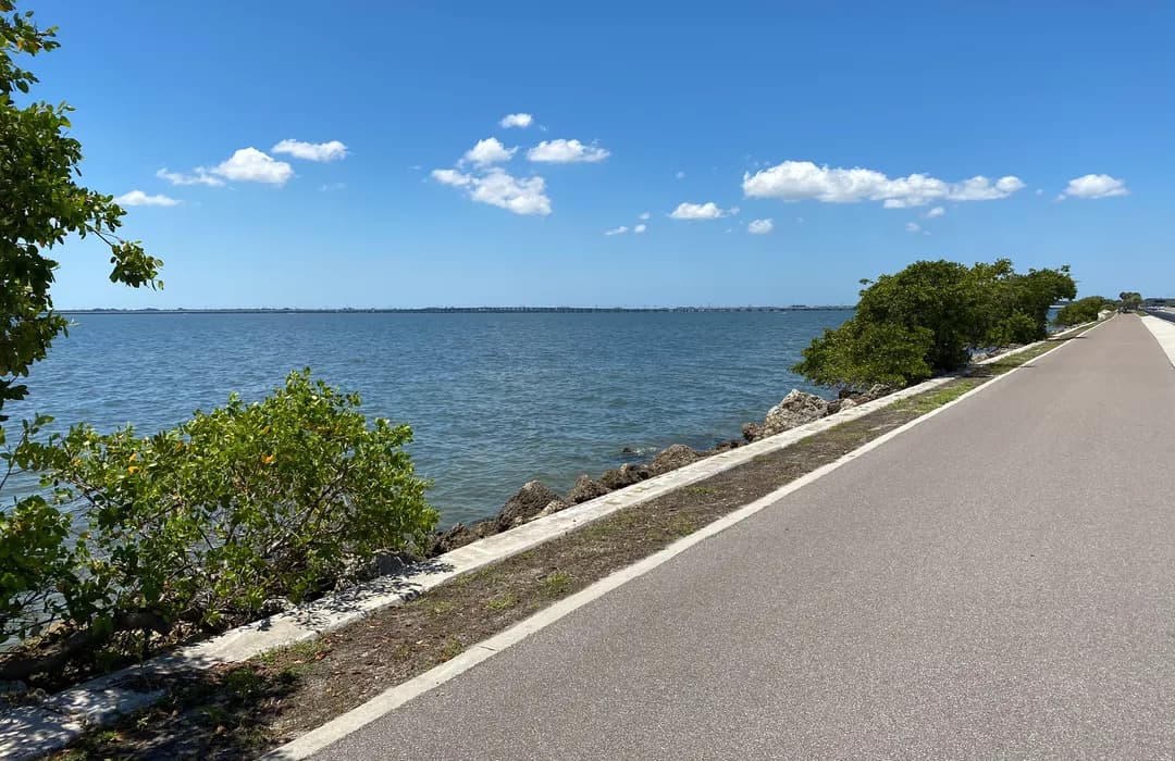 Wide coastal shared-use path of the kind that posts 15–20 mph