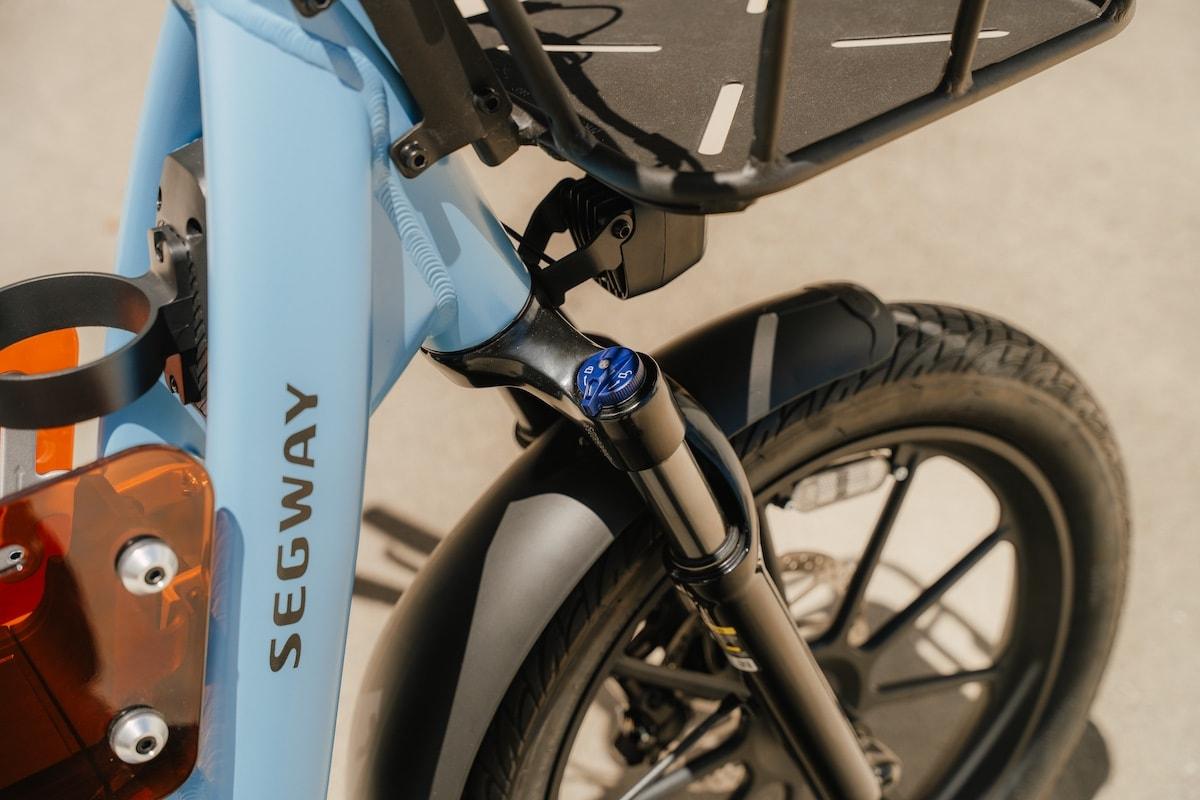 Segway Muxi Pro cargo e-bike with front basket parked on a city street